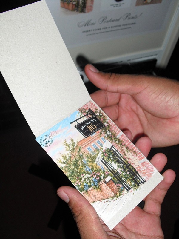A guest holding a custom mini print